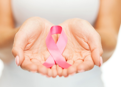 hands holding pink breast cancer awareness ribbon